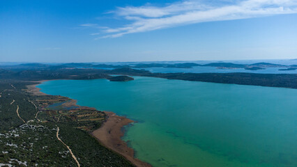 Fototapeta na wymiar Vransko lake in Dalmatia, Croatia from above with views on Adriatic sea and islands.