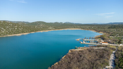 Fototapeta na wymiar Vransko lake in Dalmatia, Croatia from above with views on Adriatic sea and islands.