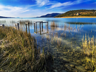 Vransko lake in Dalmatia, Croatia from above with views on Adriatic sea and islands.