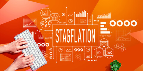 Stagflation theme with person using computer keyboard