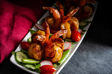 Grilled shrimp salad with arugula, snap peas, radishes, cucumber, and grape tomatoes.
.