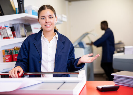 Friendly printing house worker invites you to visit the office