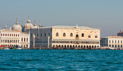 VENICE, ITALY - FEBRAURY 14, 2020: Doge's palace and Library, coloumns of St. Marco and St. Theodor from water.