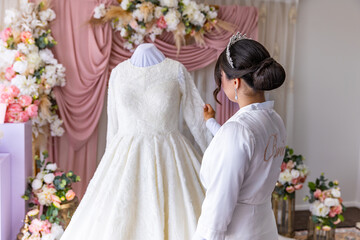 Afghani bride's traditional white wedding dress
