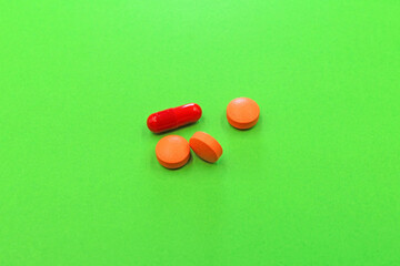 Set of drugs and pills on a green background