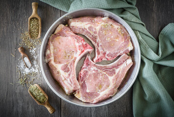 Juicy and served pork chops on the plate