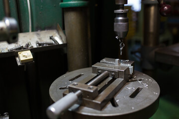 Part machining with drilling machine