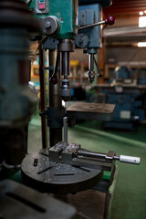 Part machining with drilling machine