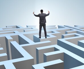 Businessman trying to escape from maze