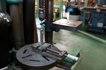 Part machining with drilling machine