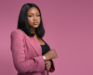 portrait Working woman African wearing a Pink suit, confident, Crossed hands looking at the camera...