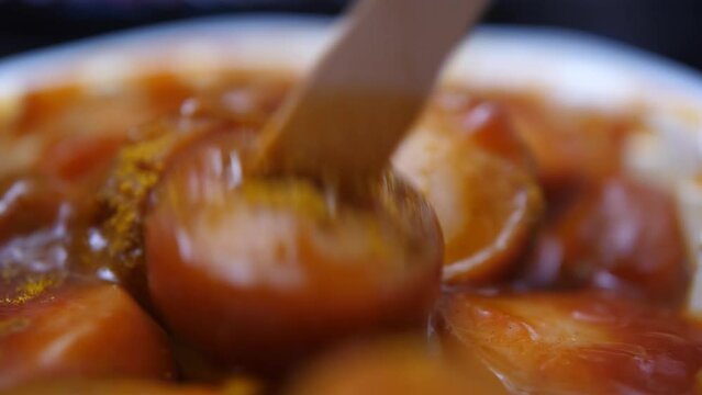 Delicious traditional German currywurst on wooden fork
