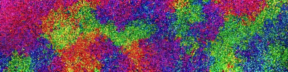 Obraz na płótnie Canvas Panoramic image of polychromatic magical glitter. Full spectrum of a rainbow of colors