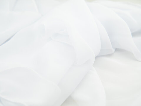 white creased fatin fabric background copy space