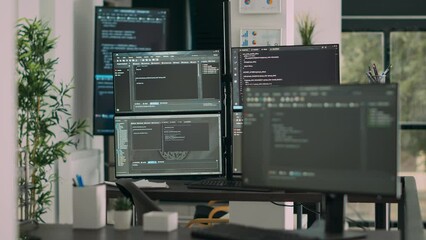 Computer screens on desk in empty data room displaying program code and algorithms, developing new user interface. Agency network servers with cloud computing script in software it office. - Powered by Adobe