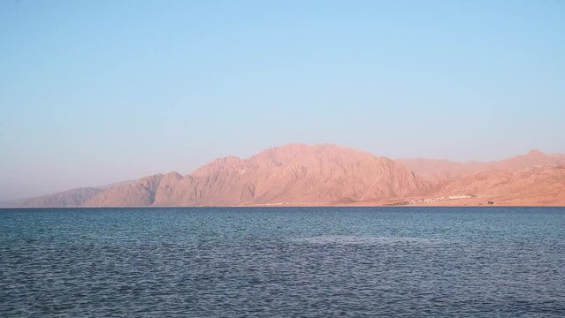 Egyption Coastal Beauty: A Sunny Beach and Mountain Landscape in Dahab City, Egypt.