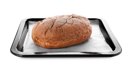 Baking pan with parchment paper and tasty bread isolated on white