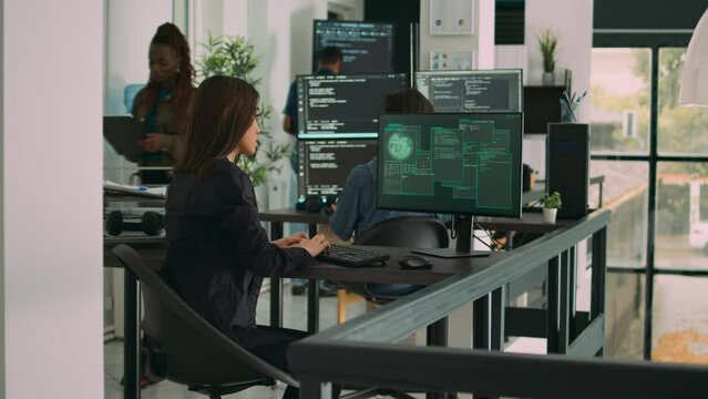 Confused asian engineer having it system hacked on computer, checking critical error message in it software agency. Trying to fix hack and save cloud computing database, app network.