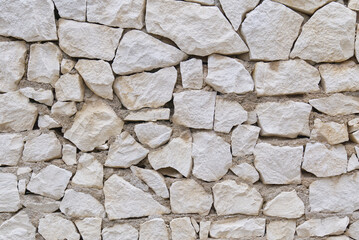 Stone fence wall texture, panoramic garden stonewall, limestone dolomite white slate slab rock texture. abstract background