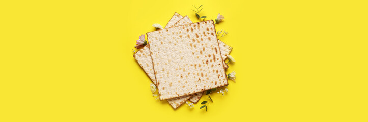 Jewish flatbread with flowers on yellow background