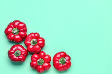 Red bell peppers on color background