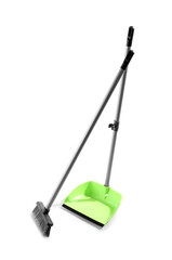 Cleaning broom with green dustpan on white background