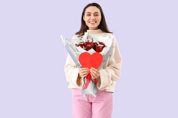 Fototapeta premium Young woman with bouquet of flowers and paper heart on lilac background. Valentine's Day celebration