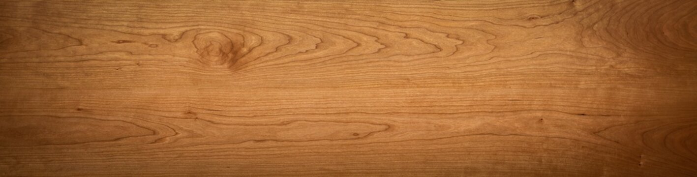 Wide plank tabletop texture background. Extra long cherry wood plank texture desktop background. Wooden planks texture background.
