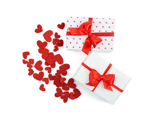 Gift boxes with beautiful bows and hearts isolated on white background. Valentine's Day celebration