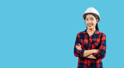 Young female engineer wearing yellow helmet stand with charming smile posture
