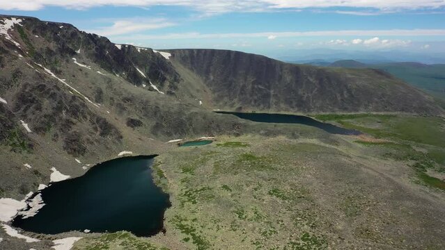 Aerial video of mount Sarlyk cirque with glacial lakes in  Altai.