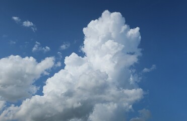 Naklejka na ściany i meble Beautiful view on blue sky with shaped clouds