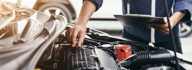 Automobile mechanic repairman hands repairing a car engine automotive workshop with a wrench, car service and maintenance,Repair service.