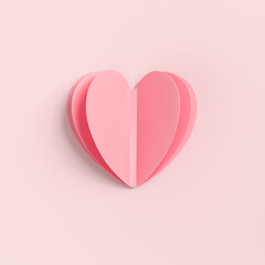 Pink paper heart on pink colored background. Minimal style valentine card or wedding invitation. Beautiful cute heart on pastel color table flat lay composition. Valentines Day greeting card concept