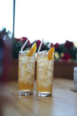 Two glasses of Lemond soda on table