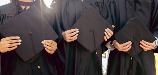 University student group, hands and holding graduation cap together in queue, cropped and success...
