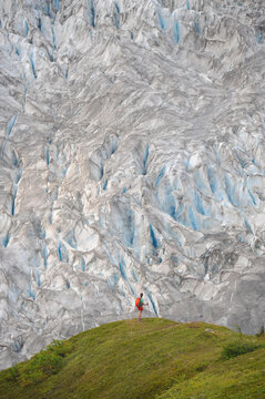 Backpacker hikes the Harding Icefield Trail in Kenai Fjords National Park near Seward, Alaska.
