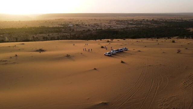Tourist Cars in Mauritania Sahara Desert at Sunset, Cinematic Aerial