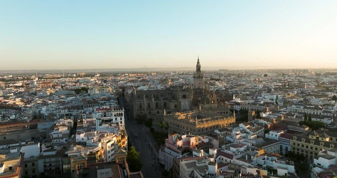 Aerial Towards The Seville Cathedral Next To The General Archive Of The Indies At Sunrise In Sevilla, Spain.