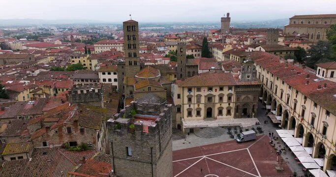 Piazza Grande With Medieval Church And Buildings In Tuscany, Italy - aerial drone shot