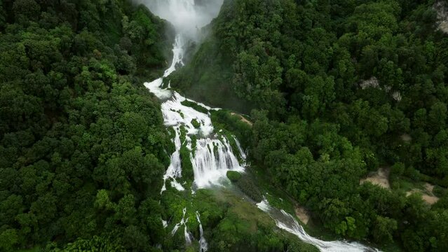 Scenic Marmore Falls Surrounded With Lush Vegetation In Umbria, Italy - aerial drone shot