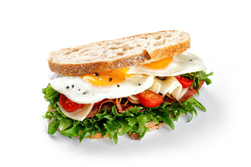 Sandwich, toast with eggs, bacon, cheese, green lettuce isolated on white background with clipping path, cut out. Fresh and healthy breakfast.