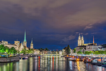 Zurich Switzerland, night city skyline at Limmat River with Grossmunster and Fraumunster Church