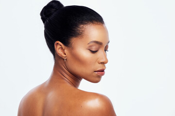 Beauty, skincare and back of black woman in studio for wellness, healthy body and dermatology. Self care, spa aesthetic and girl profile with cosmetics, glowing and natural skin on white background