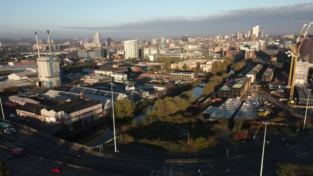 Establishing Morning Hyperlapse of Leeds City Skyline and A61 with Construction Works Cranes and River Aire and Glass Factory in West Yorkshire UK