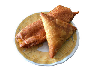 Samosa and Banana bhaji in a plate on isolated