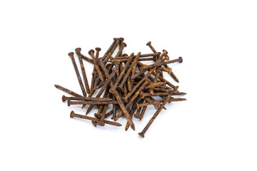 a pile of old rusty nails isolated on white background.