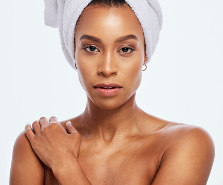 Shower, towel and portrait of black woman in studio, white background and isolated facial beauty. Female model, head and clean bathroom cloth for skincare, body dermatology and healthy face in Brazil