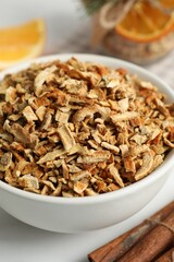 Bowl of dried orange zest seasoning, closeup