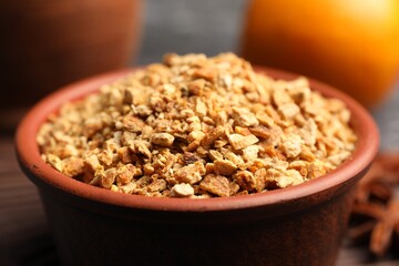 Bowl of dried orange zest seasoning, closeup